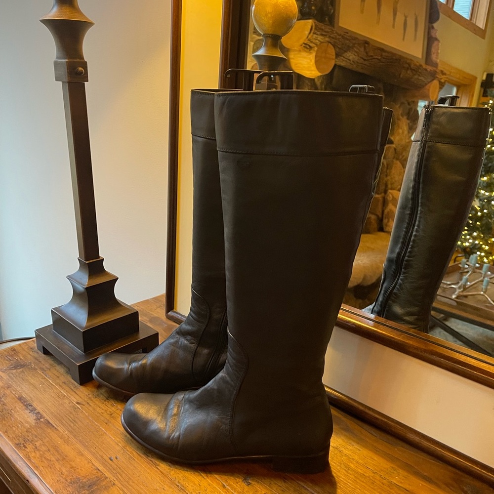 Genuine Black leather Stuart Weitzman riding boots. Lite scuffing on toe area.